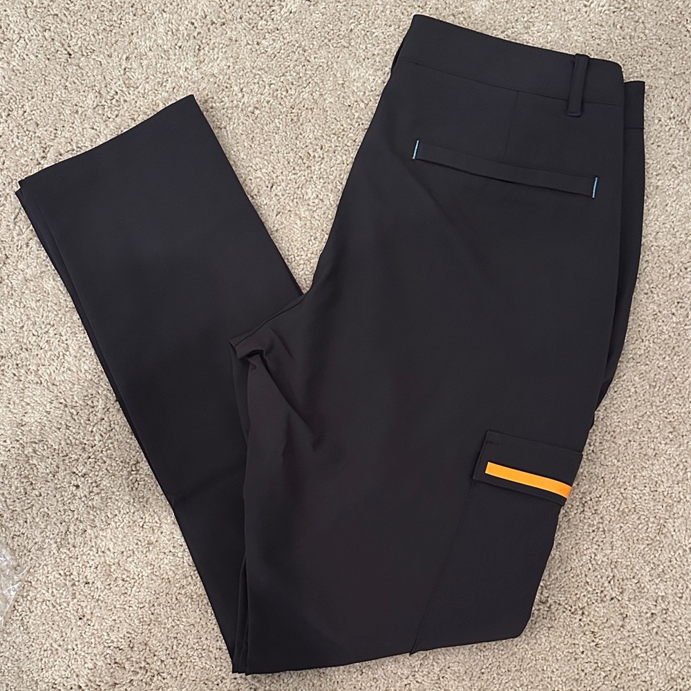 Castore Men's Black Team Pants With Blue and Papaya Accents. NWT